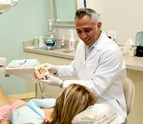 Coral_Springs_dentist_Dr_Diego_Azar_explaining_dental_implants_to_patient_at_Smile_Design_Dental_of_Coral_Springs.jpg