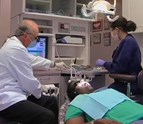 Dr_Reeves_performing_root_canal_procedure_on_patient.JPG